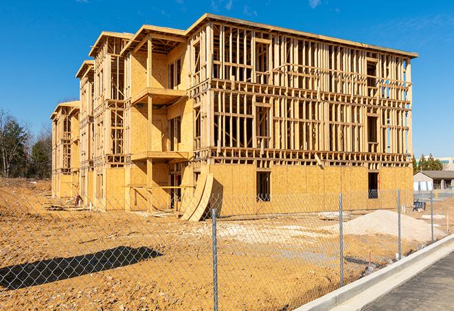 a temporary chain link fence locking away a building under renovation, serving as a security tool in Menifee